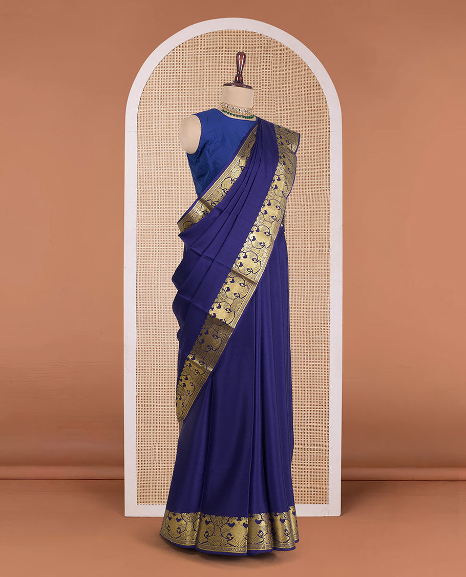 Navy blue plain Mysore silk saree, zari border of two-headed eagle motifs, and pallu steeepd with two-headed eagle motifs
