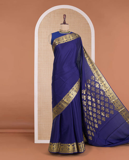 Navy blue plain Mysore silk saree, zari border of two-headed eagle motifs, and pallu steeepd with two-headed eagle motifs