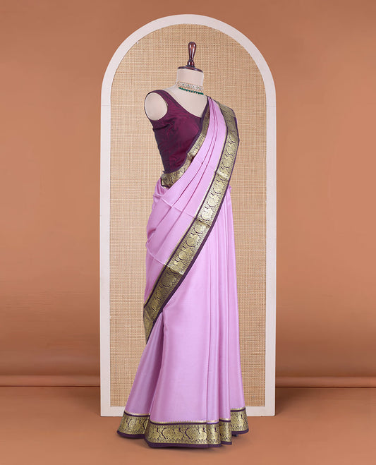 Pink plain Mysore silk saree, contrast traditional border of peacocks, and zari design pallu
