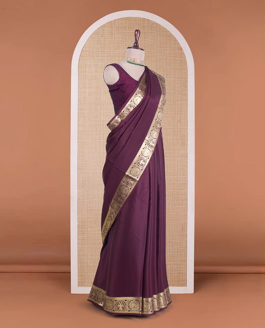 Maroon plain Mysore silk saree, zari border of Mythological animal characters, and zari striped pallu