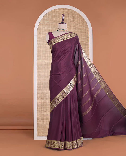 Maroon plain Mysore silk saree, zari border of Mythological animal characters, and zari striped pallu