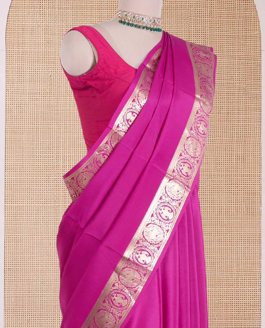 Rani plain Mysore silk saree, zari border of Mythological animal characters, and zari striped pallu