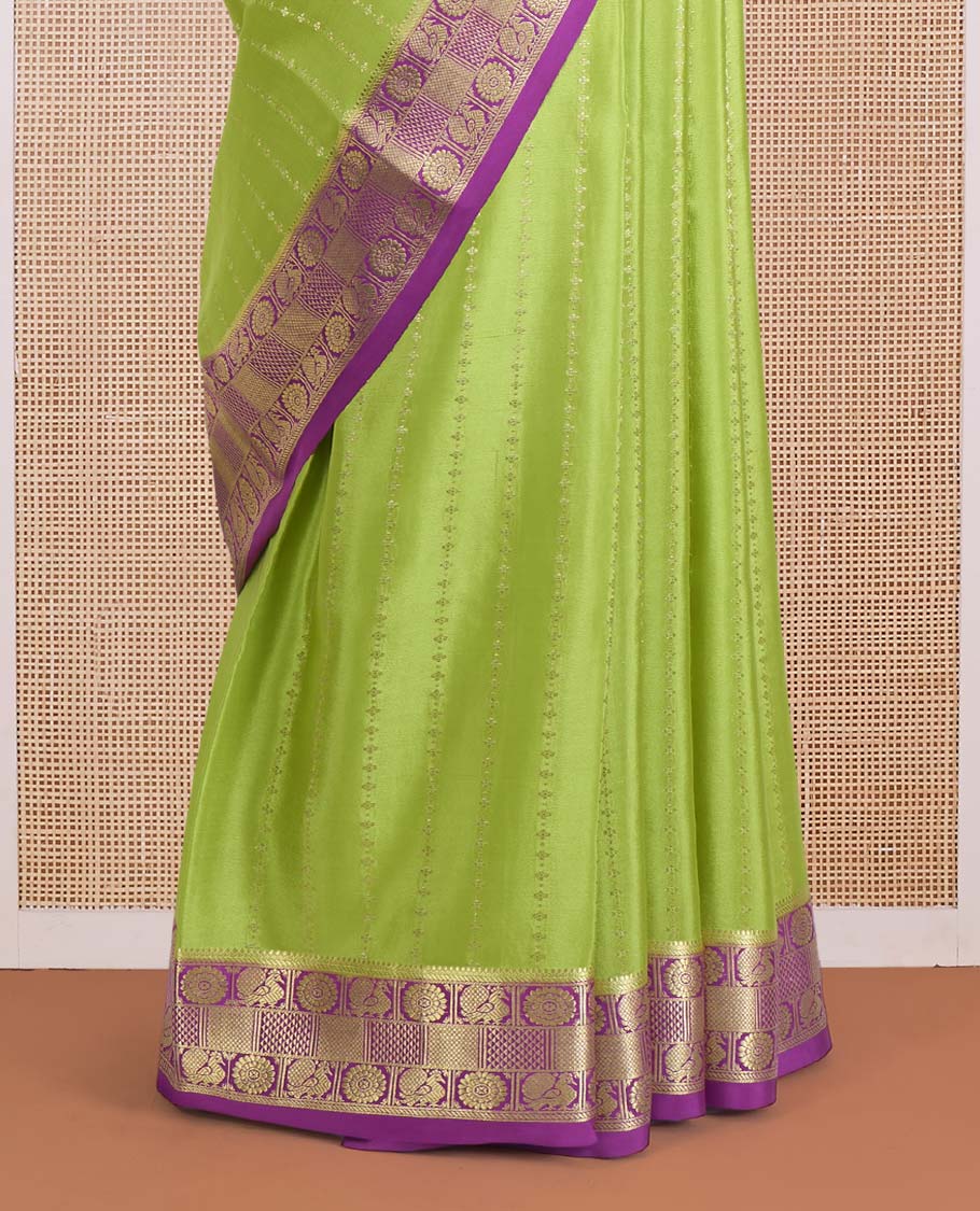 Parrot green zari design Mysore silk saree, contrast peacock chakra motifs border, and traditional zari design woven pallu