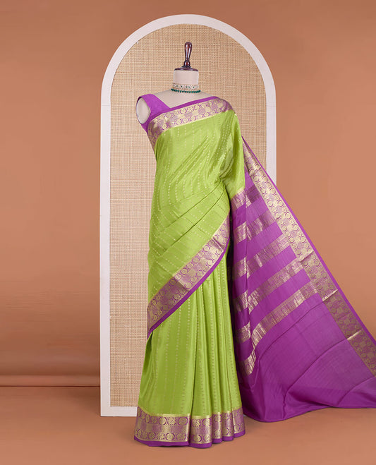 Parrot green zari design Mysore silk saree, contrast peacock chakra motifs border, and traditional zari design woven pallu