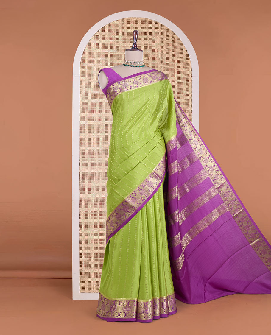 Parrot green zari design Mysore silk saree, contrast peacock chakra motifs border, and traditional zari design woven pallu