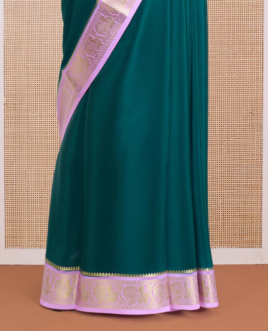 Dark green plain Mysore silk saree, contrast traditional zari border of peacocks, and zari design pallu