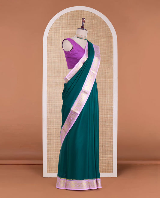 Dark green plain Mysore silk saree, contrast traditional zari border of peacocks, and zari design pallu