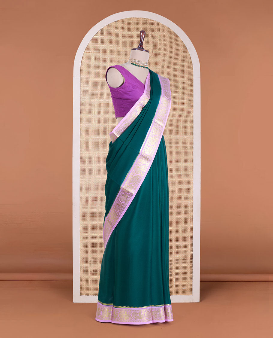 Dark green plain Mysore silk saree, contrast traditional zari border of peacocks, and zari design pallu