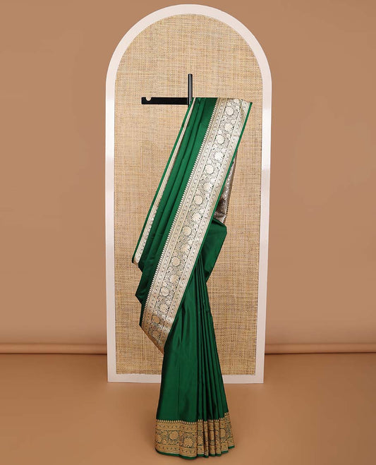 Dark green semi banaras nylon saree with self floral design border & floral ogee design pallu