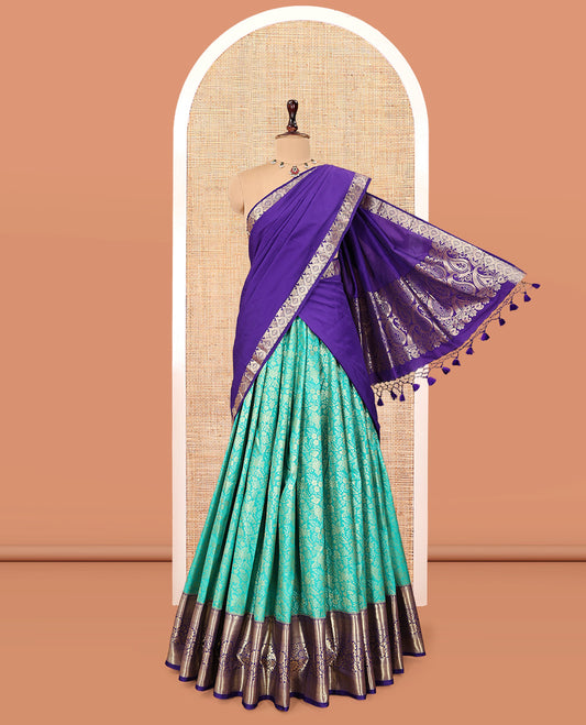 Turquoise Art Silk Material Half Saree, Bedecked with Jacquard Skirt, a Contrast Traditional Zari Border, Contrast Blouse, and an Intricate Dhavani