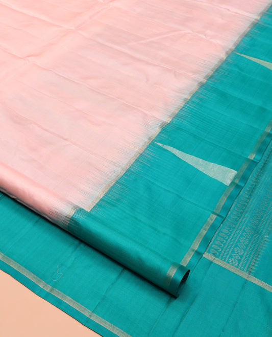 Peach Kanchipuram Silk Saree, Sparsely Woven with Buttas, Complemented by a Contrast Thazampoo Rekku Border, Chevron Striped Pallu, and a Contrast Blouse