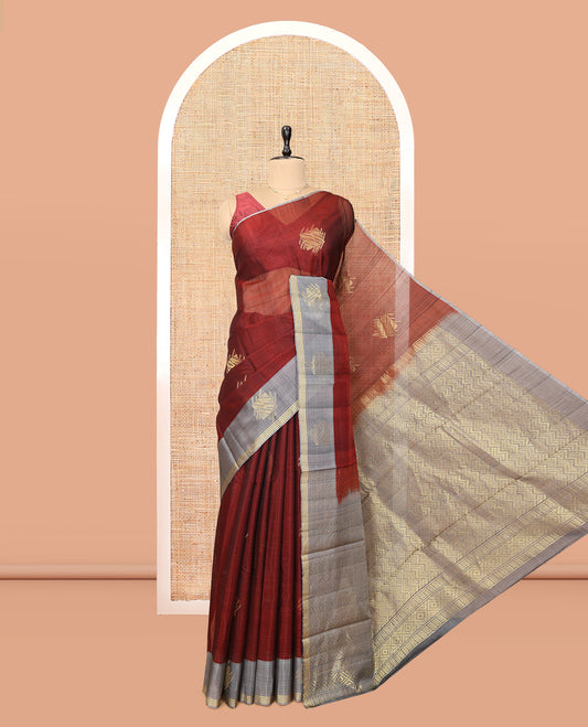 Maroon Cotton Saree, Complemented by a Contemporary Leaf Buttas, a Contrast One-Side Zari Motif Border, a Chevron Pallu, and a Contrast Blouse