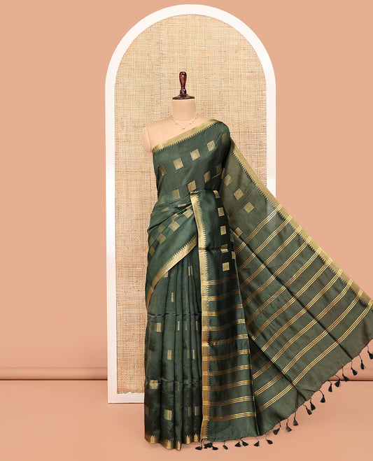 Green Banana Pith Saree, Sparsely Sparkled with Square Buttas All Over Its Body, Highlighted by a Zari Temple Border, Gleaming Zari Striped Pallu, and Paired with a Matching Blouse