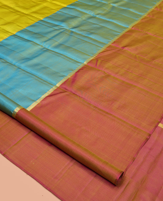 Borderless Multi-Colored Kanchipuram Silk Saree, Subtly Sparkled with Two-Horizontal Zari Stripes Running on Its Body, a Plain Pallu, and Paired with a Contrast Blouse