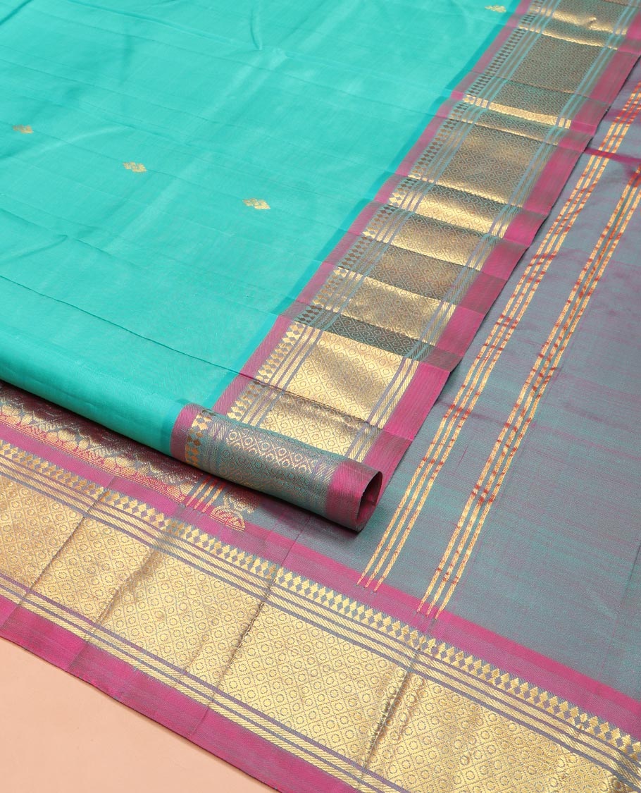 Blue Kanchipuram Silk Saree, Bedecked with Zari Buttas on Its Body, Complemented by a Contrast One-Sided Border of Panner Sombu, Banaras, and Jaal Designs, Pallu Features Floral Creeper Designs, and Comes Without a Blouse