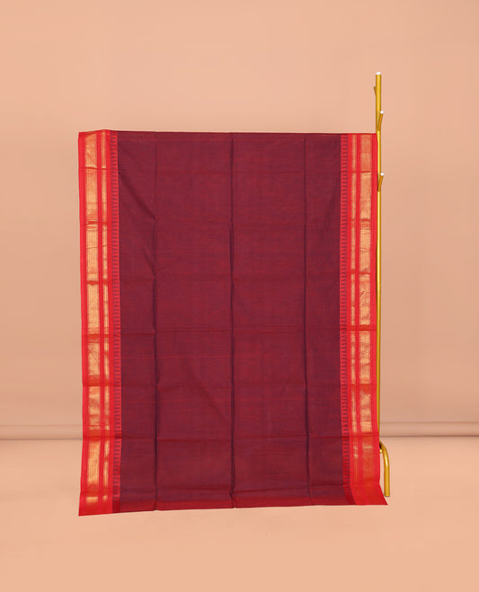 Maroon Plain Chettinad Cotton Saree, Complemented by a Contrast Traditional Zari Design Temple Border, Pallu of Stripes and Buttas, and Paired with a Matching Blouse