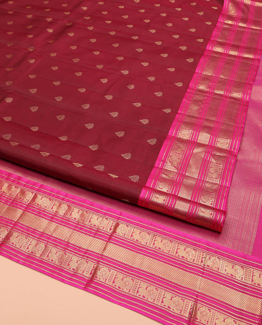 Red Kanchipuram Silk Saree, Opulently Embellished with Mayil Buttas on Its Body, Complemented by Contrast Border of Kathir, and Mayil Designs, Pallu Depicting Mayil Kann Designs, and Paired with a Contrast Blouse
