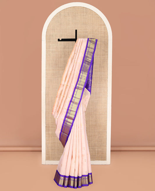 Light Sandal Kanchipuram Silk Saree, Delicately Woven with Zari Buttas on Its Body, Complemented by a Contrast One-Sided Korvai Border of Mayil, and Chevron Designs, Pallu of Floral Jaal Designs, and Comes Without a Blouse