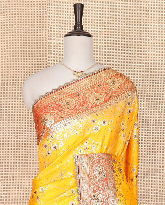 Yellow Art Vastrakala Silk Saree Mesmerized with Meenakari Jacquard with Stone Work All Over Its Body, Complemented by a Contrast Floral Creeper Zari Stone Work Lace Border, Pallu Detailed in Zari and Stone Work, and Paired with a Contrast Blouse