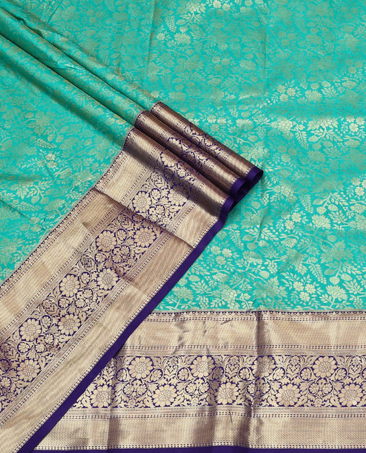 Turquoise Art Silk Material Half Saree, Bedecked with Jacquard Skirt, a Contrast Traditional Zari Border, Contrast Blouse, and an Intricate Dhavani