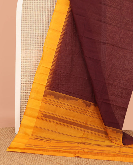 Brown Plain Kanchi Cotton Saree, Complemented by a Contrast Temple Border, Subtly Striped Pallu, and Paired with a Contrast Blouse
