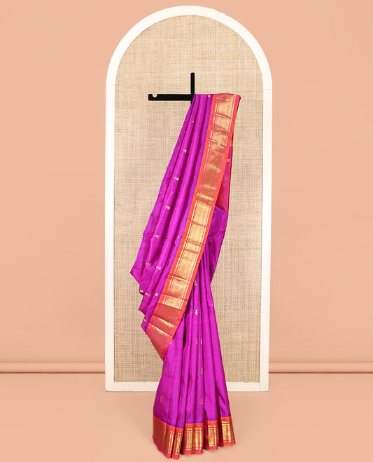 Pink Kanchipuram Silk Saree, Embellished with Zari Buttas, Complemented by a Contrast One-Sided Border of Thilakam Mokku, Banaras, and Jaal Designs, Zari Design Pallu, and No Blouse