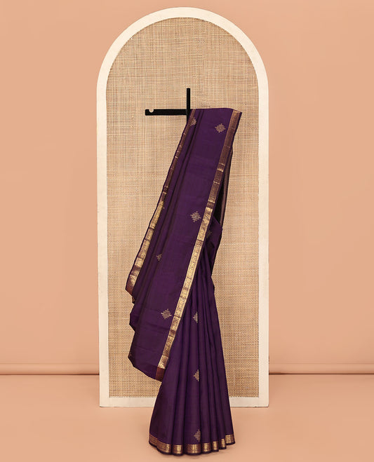 Purple Kanchipuram Silk Saree, Enriched with Kolam Buttas All Over Its Body, Highlighted by Zari Border of Rekku, Muthu, Mayil, Yaanai, and Rettai Neli Designs, Pallu Gleamed with Diagonal Stripes and Mayil Designs, and Paired with a Matching Blouse