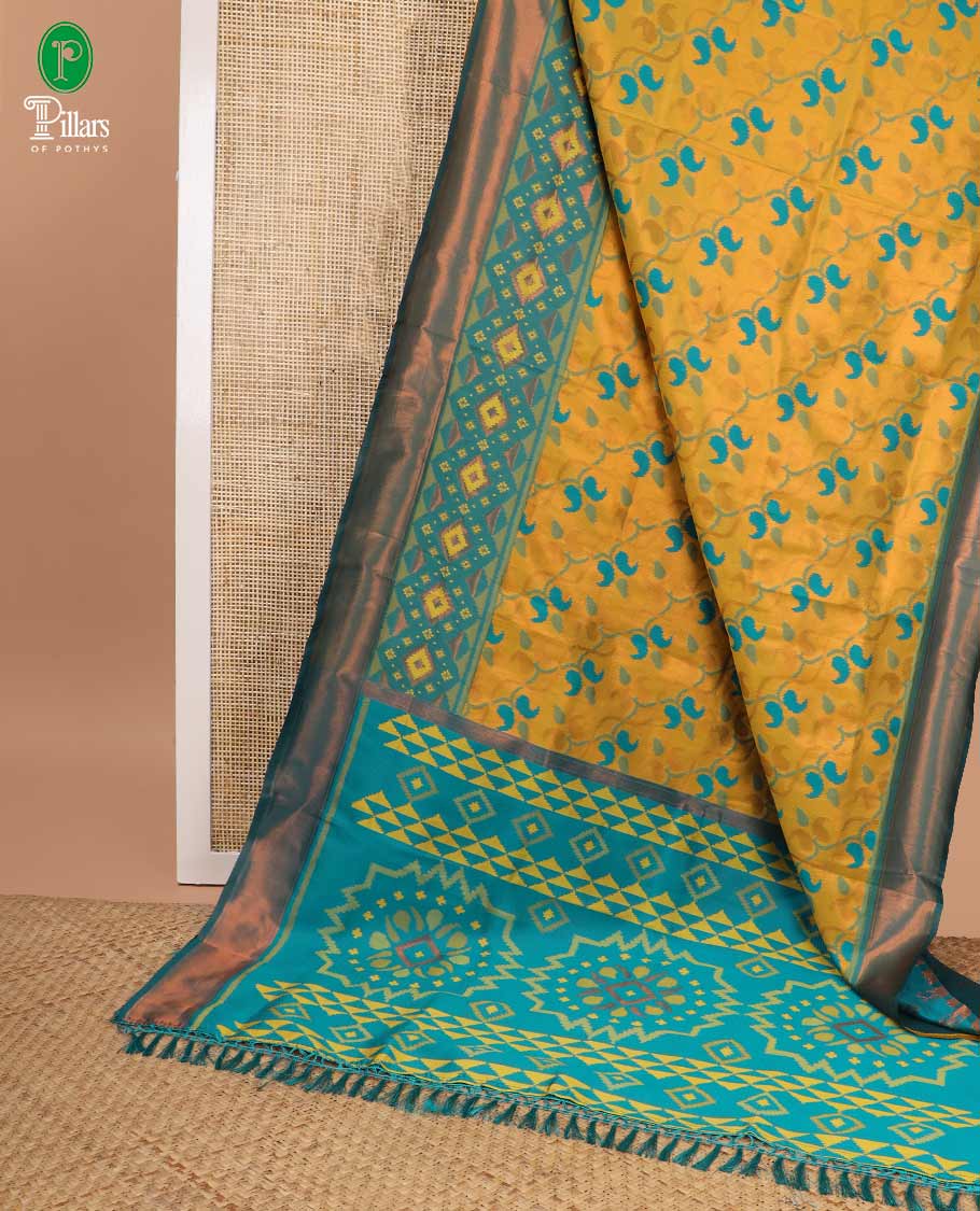 Mustard patola design litchi silk saree with contrast border & contrast pallu along with contrast blouse