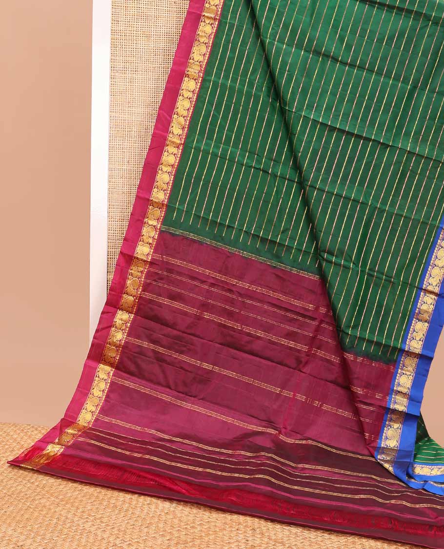 Green striped kancheepuram silk saree with contrast ganga jamuna border of paisley, mayil design & zari design pallu