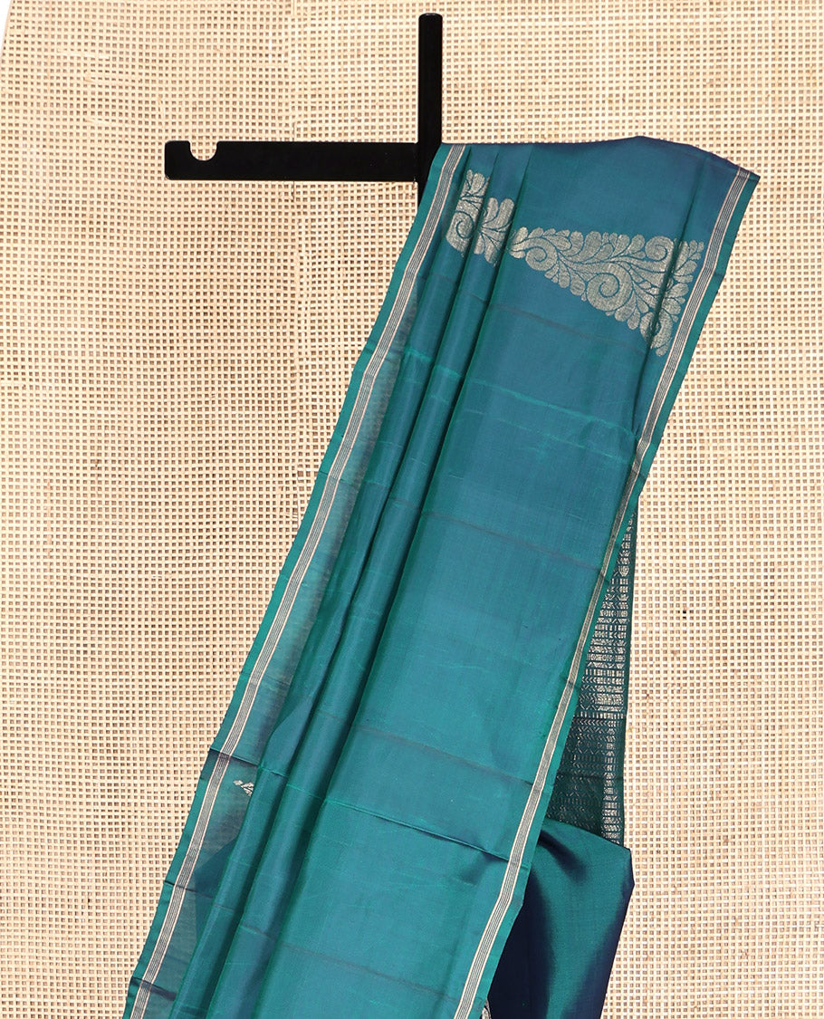 Peacock Blue Mayuri Lite Silk Mix Saree, Highlighted by Zari Buttas, a Subtle Piping Border, Pallu Steeped with Geometric Designs, and a Matching Blouse
