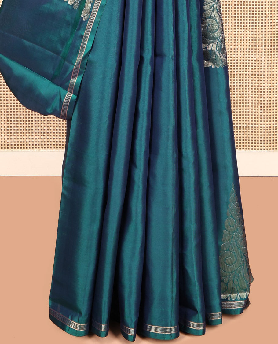 Peacock Blue Mayuri Lite Silk Mix Saree, Highlighted by Zari Buttas, a Subtle Piping Border, Pallu Steeped with Geometric Designs, and a Matching Blouse