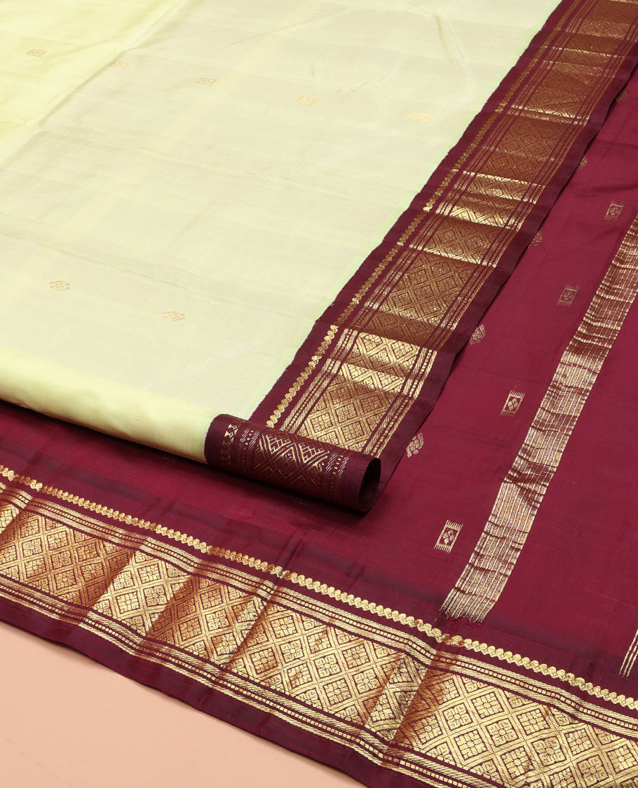 Light Green Kanchipuram Silk Saree, Delicately Woven with Zari Buttas on Its Body, Complemented by a Contrast One-Sided Border of Salngai, Banaras, Muthu, and Jaal Designs, Pallu of Zari Designs, and Comes Without a Blouse