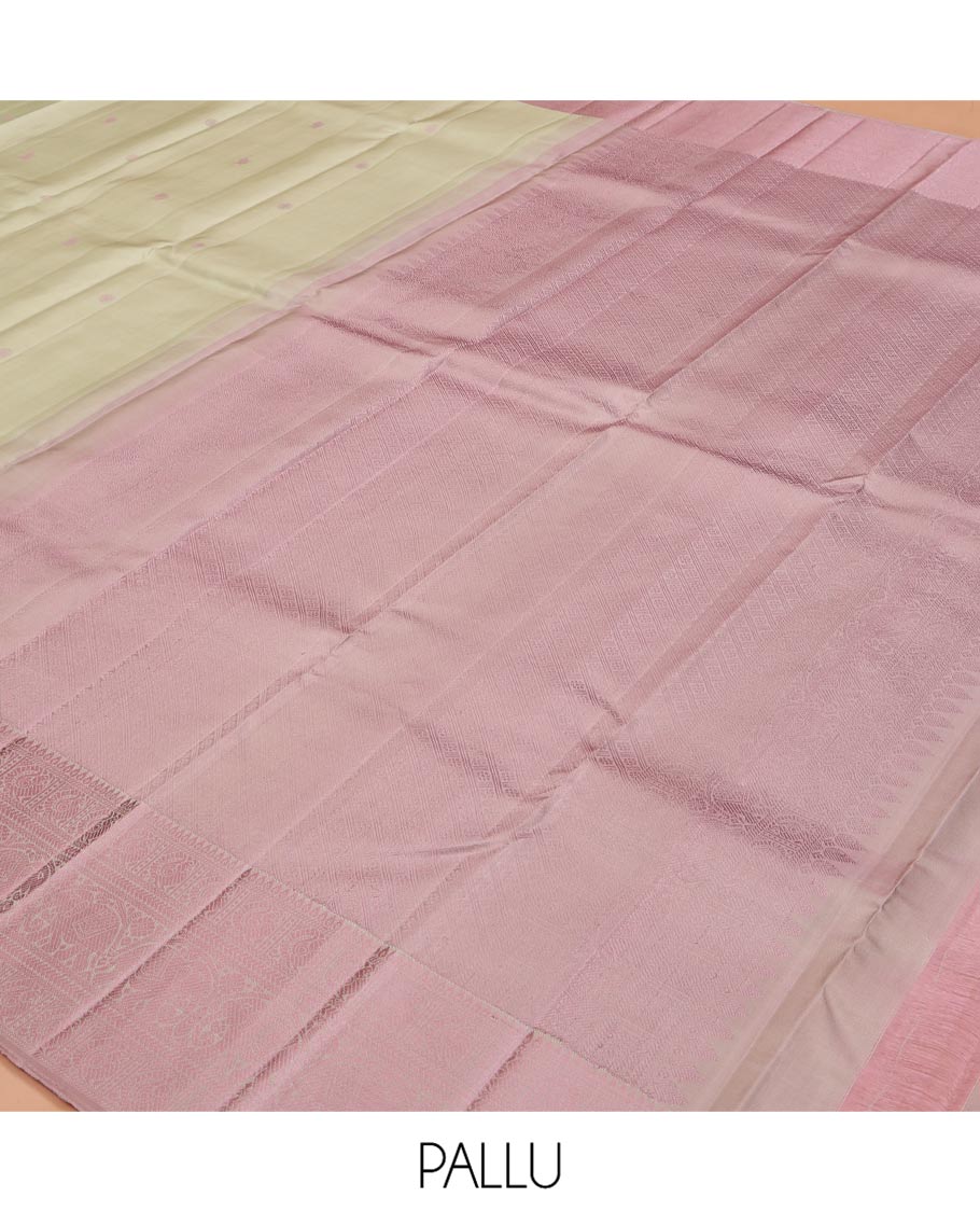 Green Kanchipuram Silk Saree, Subtly Enriched with Mayil-Chakram Buttas All Over Its Body, Complemented by a Contrast Border of Thilakam, Banaras, Mayil, Kathir, and Yaanai Designs, Pallu Steeped with Kamalam Designs, and Paired with a Contrast Blouse