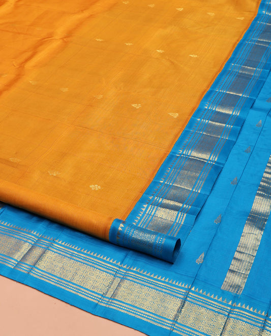 Yellow Kanchipuram Silk Saree, Dazzled with Zari Buttas on Its Body, Complemented by a Contrast One-Sided Korvai Border of Rekku, Banaras, Muthu, and Jaal Designs, Pallu of Zari Designs, and Comes Without a Blouse