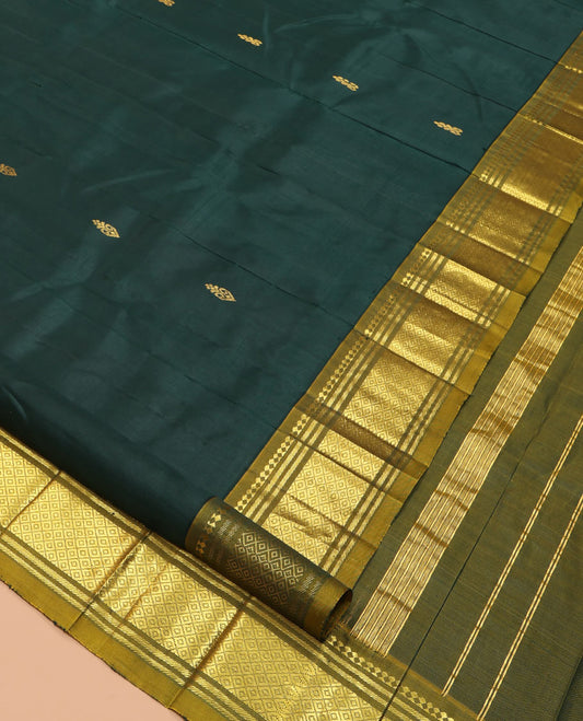 Green Kanchipuram Silk Saree Featuring Zari Buttas, Complemented by a Contrast One-Sided Border of Panner Sombu, Banaras, and Jaal Designs, Zari Design Pallu, and a No Blouse