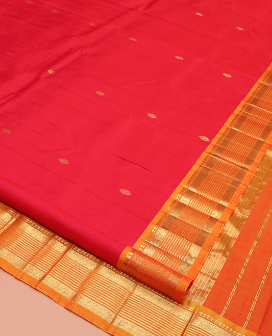 Red Kanchipuram Silk Saree, Decked Up with Buttas, a Contrast One-Sided Traditional Zari Border, Zari-Woven Pallu, and No Blouse