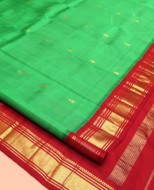 Green Kanchipuram Silk Saree, Decorated with Zari Buttas, Contrast Korvai Border of Thilakam Mokku, Banaras, and Mayil Kann, Pallu of Zari Design, and No Blouse