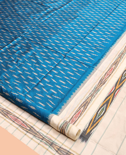 Blue Pochampally Ikat Silk Saree, Ornamented with Ikat Buttas, Complemented by a Contrast Ikat Border, Ikat-Style Pallu, and No Blouse