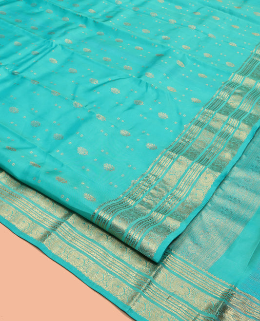 Turquoise Vasundhara Lite Silk Mix Saree, Decked Up with Zari Buttas, Highlighted by a Zari Border of Kathir, Muthu, and Mayil Designs, Intricate Pallu, and a Matching Blouse