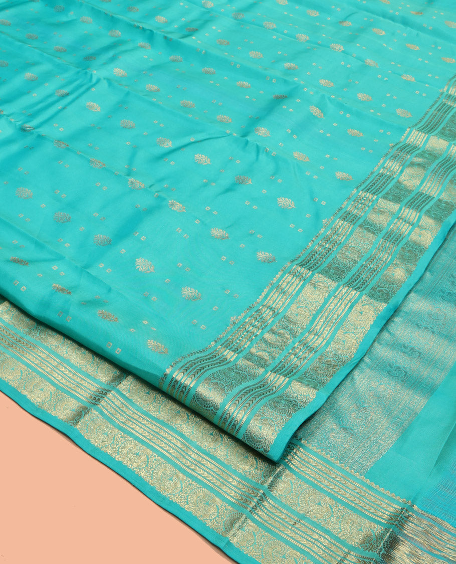 Turquoise Vasundhara Lite Silk Mix Saree, Decked Up with Zari Buttas, Highlighted by a Zari Border of Kathir, Muthu, and Mayil Designs, Intricate Pallu, and a Matching Blouse