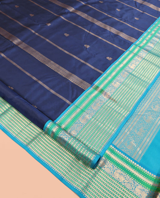 Blue Zari Design Vasundhara Silk Saree, Complemented by Contrast Border of Thilakam Mokku, Muthu, Yaali, and Chakram, Jaal Pallu, and a Contrast Blouse