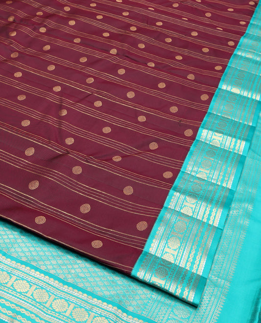 Maroon Vasundhara Silk Saree, Adorned with Stripes and Chakram Buttas, Complemented by a Contrast Border of Salngai, Neli, Kathir, and Chakram Design, Intricate Pallu, and a Contrast Blouse