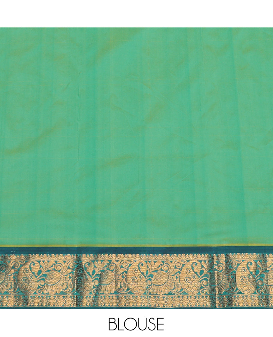 Green Art Silk Pavadai Material Set, Delicately Woven with Zari Designs on Its Skirt, Complemented by a Contrast Paisley Zari Border, and a Matching Blouse
