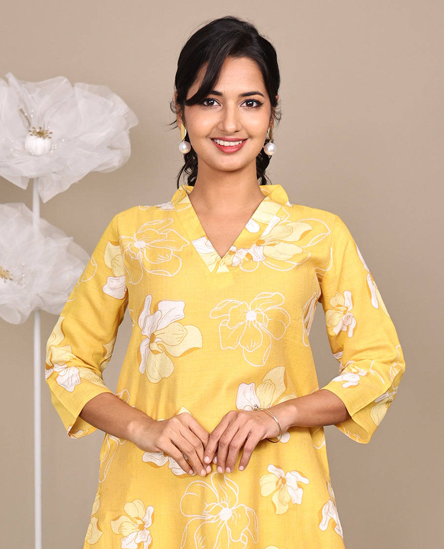 Yellow Flower Motifs Printed Below-Knee-Length Cotton Kurti, Adorned with V-Neckline, 3/4 Sleeves, Straight Cut Length