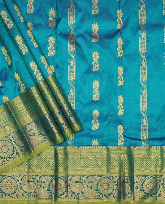 Blue pure-silk half-saree, zari buttas with contrast mayil chakra bordered skirt, contrast zari design blouse, and mat textured dhavani