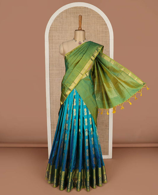 Blue pure-silk half-saree, zari buttas with contrast mayil chakra bordered skirt, contrast zari design blouse, and mat textured dhavani