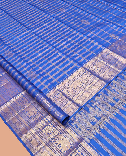 Blue Kanchipuram Silk Saree, Adorned with Zari Buttas and Checks, a Zari Border of Rekku, Kathir, Muthu, Rudraksham, Rekku, Yaanai, Chakram, and Paiyaddi Kattam, Jaal Pallu, Matching Blouse