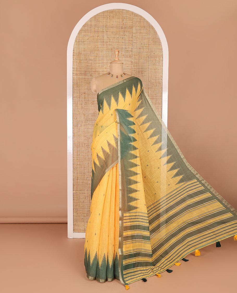 Yellow small thread buttas linen cotton saree, contrast temple zari piping border, striped pallu and a contrast blouse