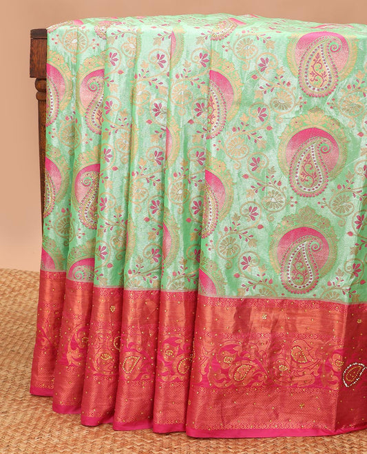 Mint green floral design vastrakala silk saree with stone work, contrast floral stone work scallop border & floral design in stone work pallu