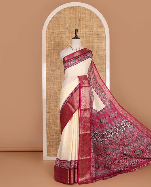 Cream-magenta zari striped dola silk saree, contrast traditional zari border of leaf creeper, Ajrakh printed pallu, and Ajrakh printed blouse